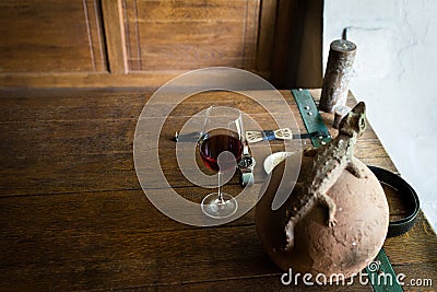 A glass of red wine on the table. Menâ€™s accessorizes Stock Photo
